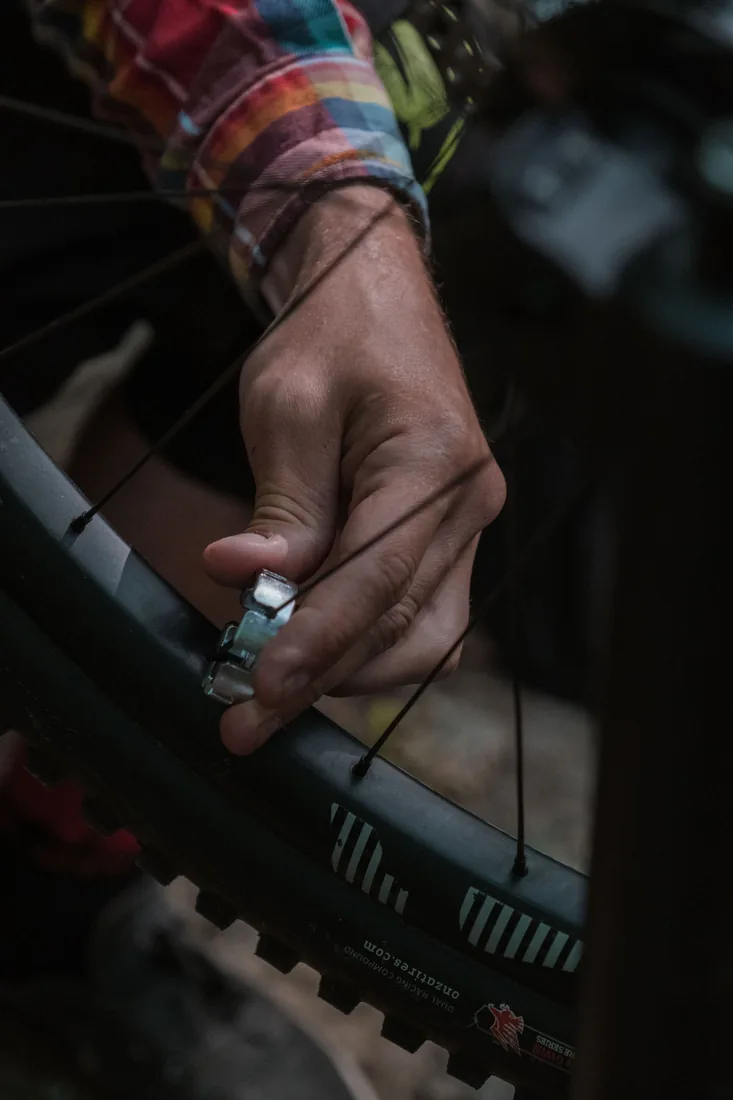 Mechanic servicing an off-road vehicle wheel