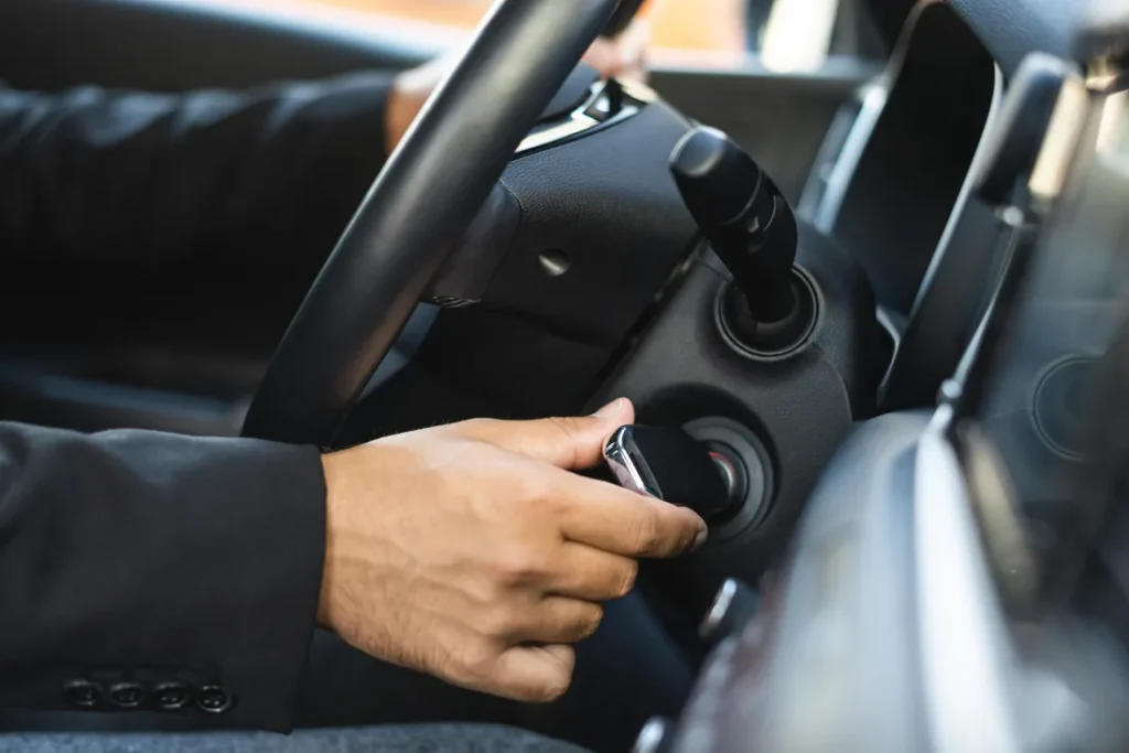 Home Driver starting a car with a key in the ignition