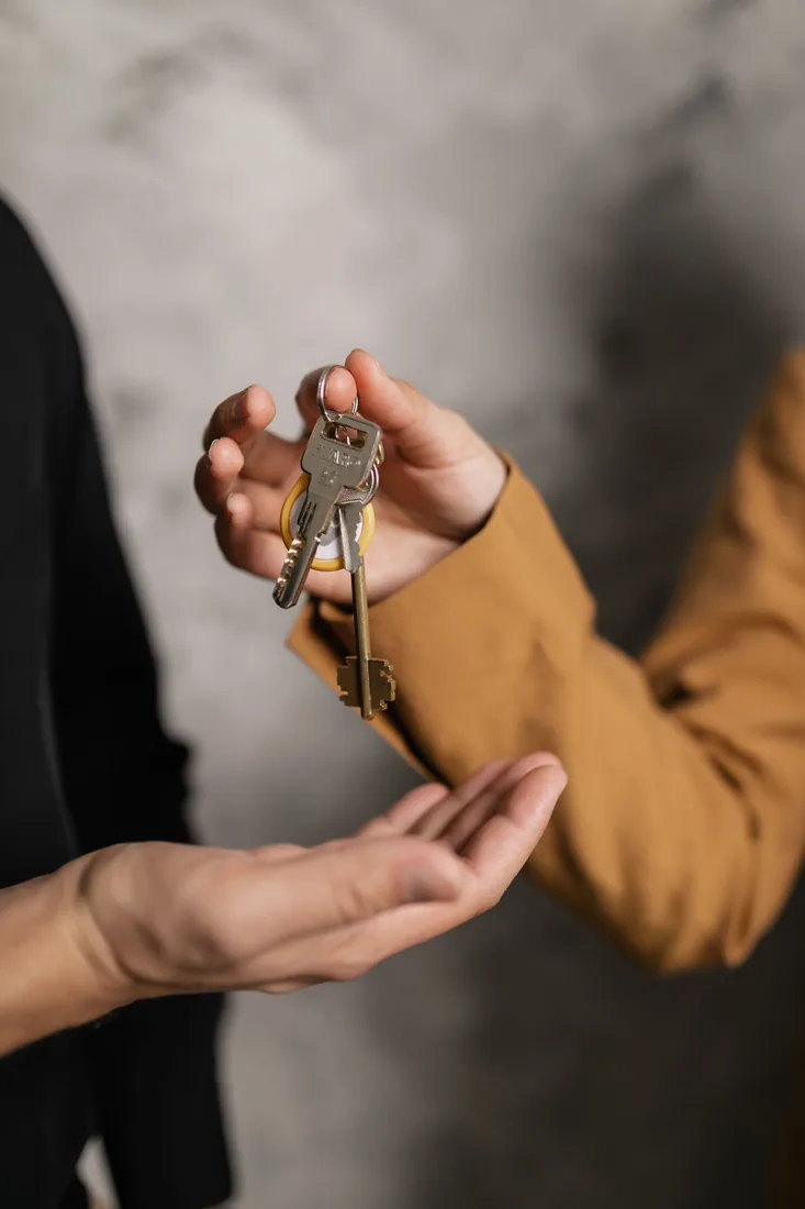 Set of keys being handed to a customer