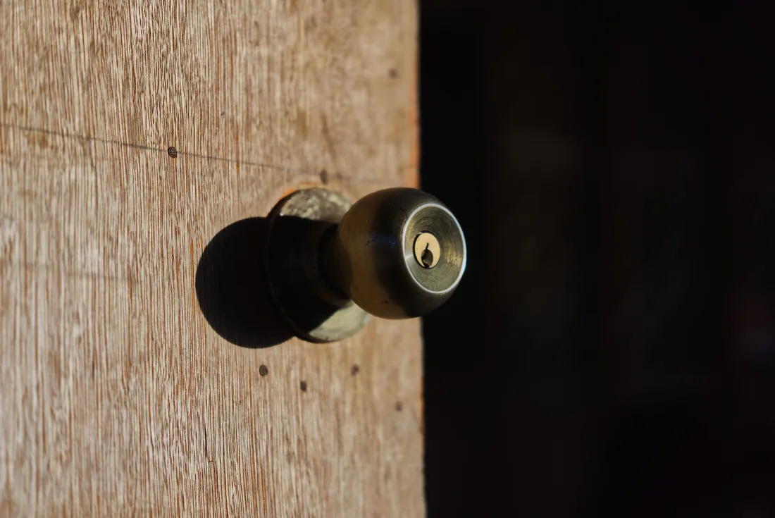 Close-up of gate latch hardware