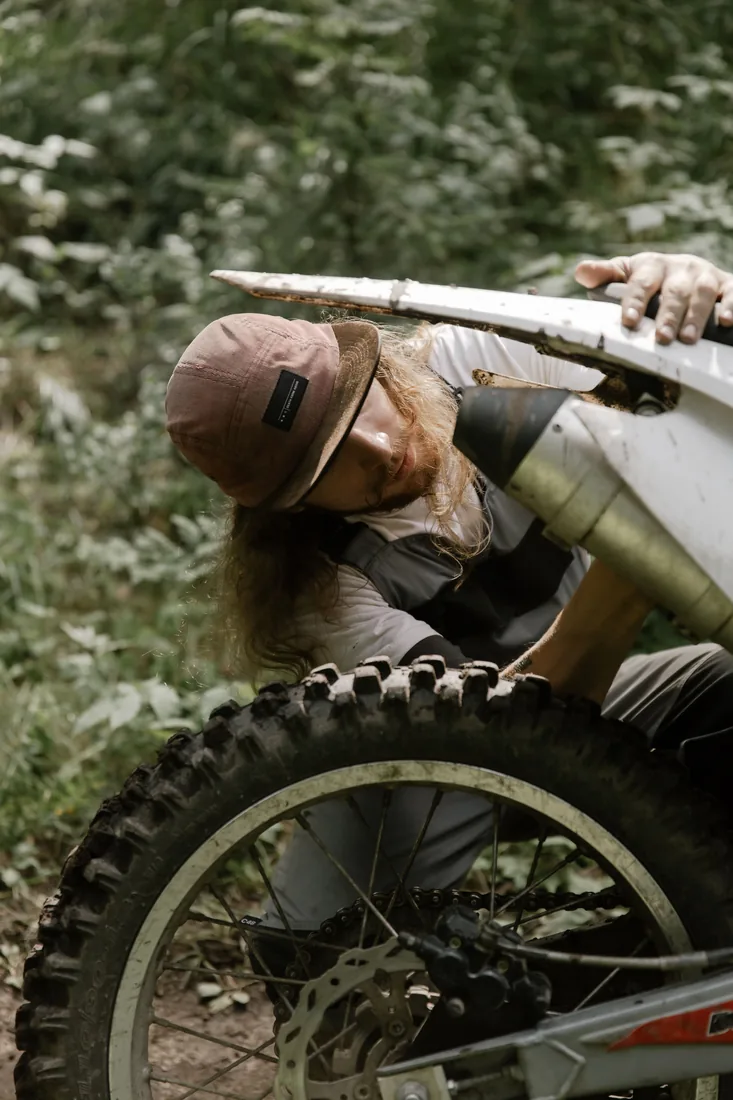 Mechanic repairing a motorcycle ignition