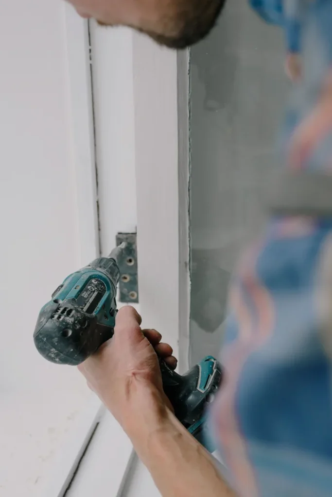 Locksmith Stanton Locksmith working on a door lock with a power tool