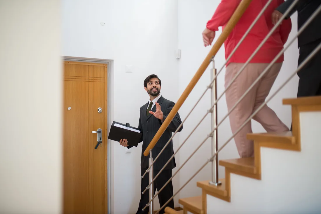 Property manager at the entry door of a residential building
